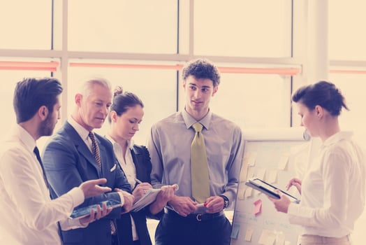 young startup businessman making presentation to senior investior photo