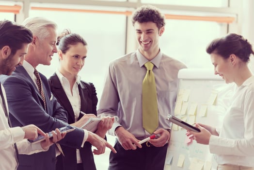 young startup businessman making presentation to senior investior photo