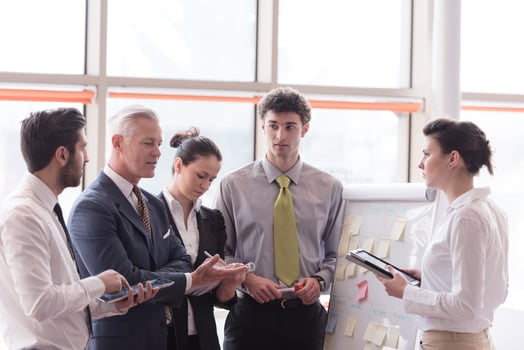 young startup businessman making presentation to senior investior photo