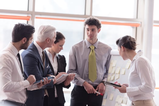 young startup businessman making presentation to senior investior photo
