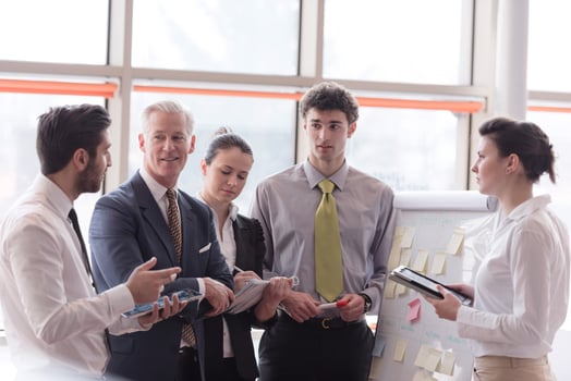 young startup businessman making presentation to senior investior photo
