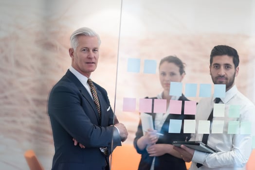 young creative business people with senior ceo photo