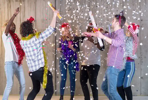 multiethnic group of casual business people having confetti party photo