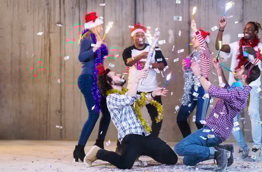 multiethnic group of casual business people having confetti party photo