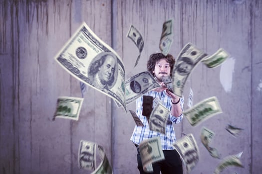 businessman making the rain of money photo