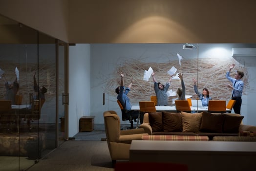 Group of young business people throwing documents photo