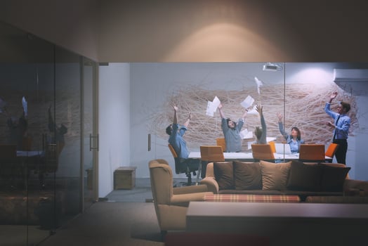 Group of young business people throwing documents photo