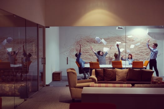Group of young business people throwing documents photo