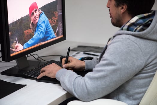 photo editor at his desk
