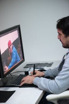 photo editor at his desk