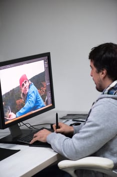 photo editor at his desk