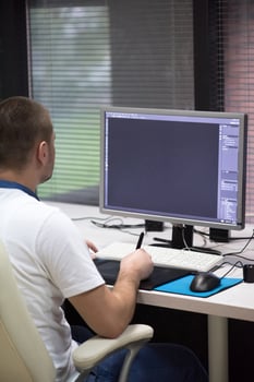photo editor at his desk