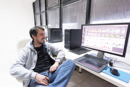 photo editor at his desk