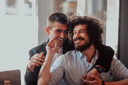 Diverse friends gay couple hugging. Stylish cool generation z men dating in love enjoy romantic relationships photo