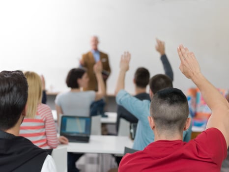students group raise hands up on class photo