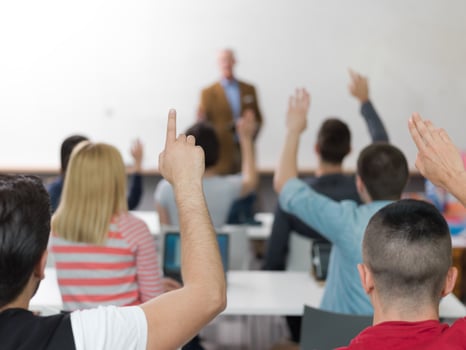 students group raise hands up on class photo
