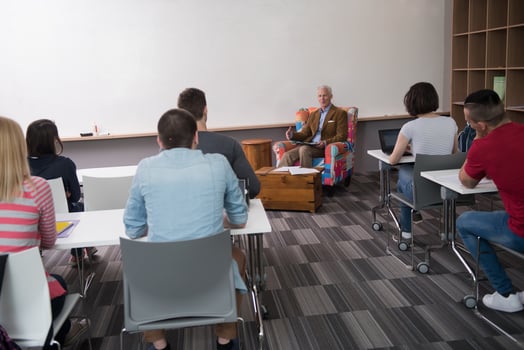 teacher with a group of students in classroom photo