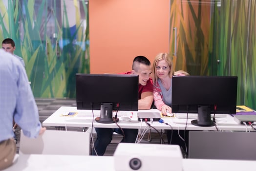 teacher and students in computer lab classroom photo