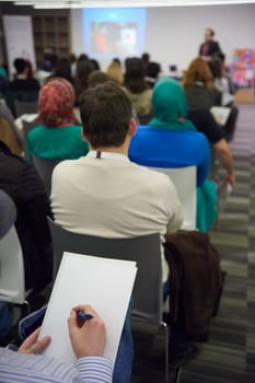 taking notes on business conference photo