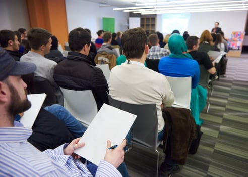 taking notes on business conference photo