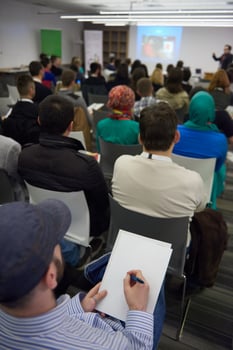 taking notes on business conference photo