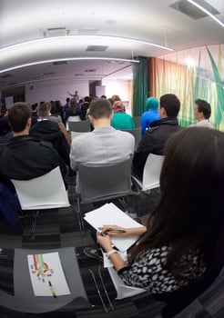 taking notes on business conference photo