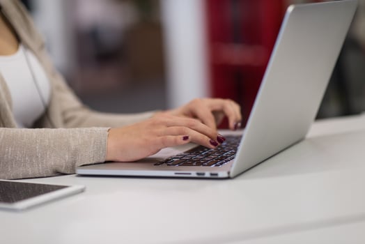 businesswoman using a laptop in startup office photo
