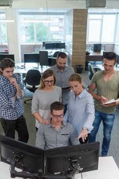 startup business people group working as team to find solution photo