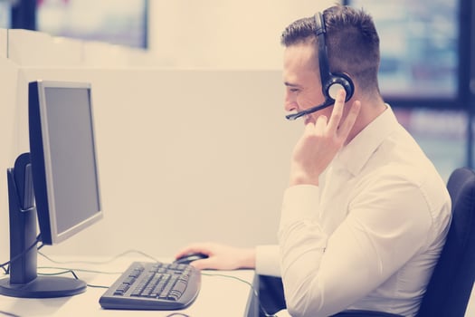 male call centre operator doing his job photo