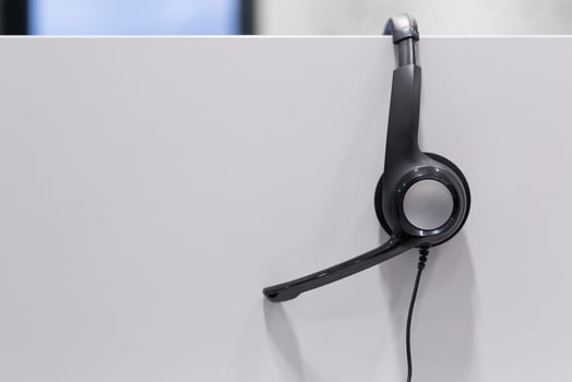Headphones in empty call center office photo