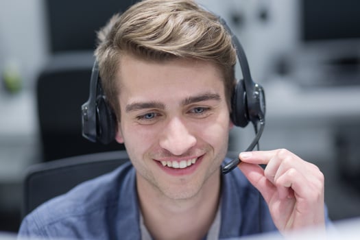 male call centre operator doing his job photo