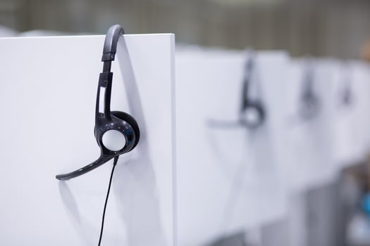 Headphones in empty call center office photo