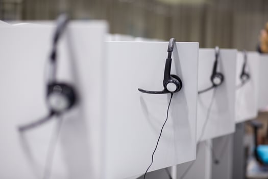 Headphones in empty call center office photo