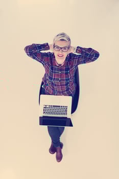 top view of young business woman working on laptop computer photo