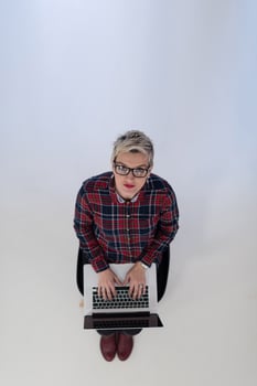 top view of young business woman working on laptop computer photo