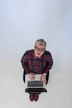top view of young business woman working on laptop computer photo