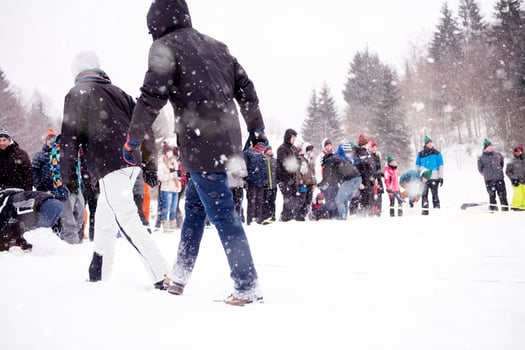 group of young people having a running in bag competition photo