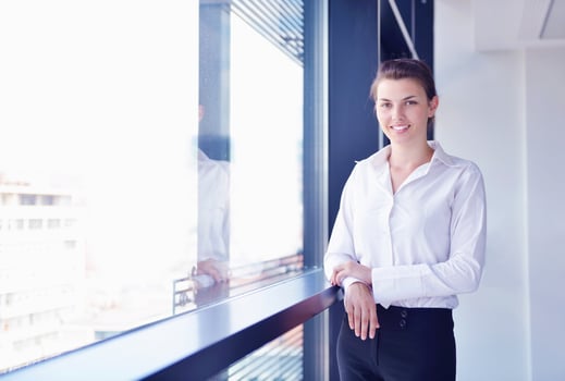business woman with her staff in background at office photo