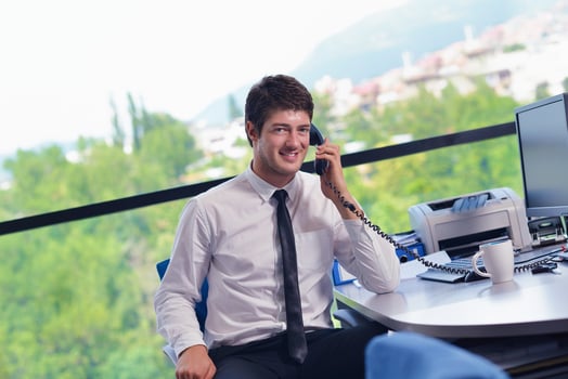 happy young business man at office photo