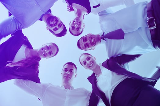 business people with their heads together photo