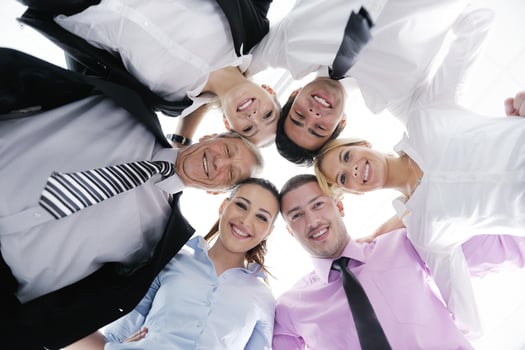 business people with their heads together photo