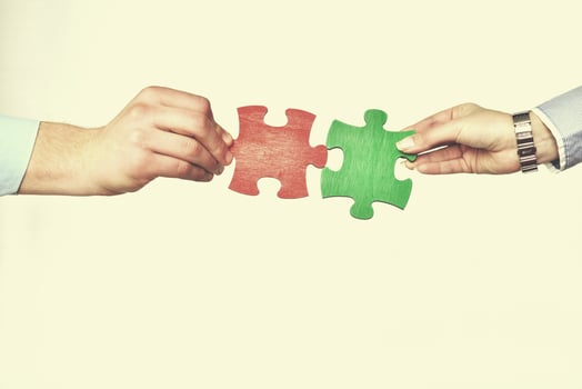 Group of business people assembling jigsaw puzzle photo
