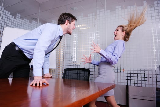 Angry busines sman screaming at employee photo