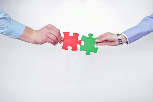 Group of business people assembling jigsaw puzzle photo