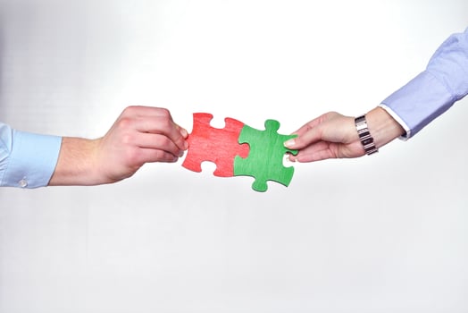 Group of business people assembling jigsaw puzzle photo