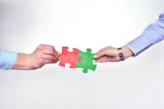 Group of business people assembling jigsaw puzzle photo