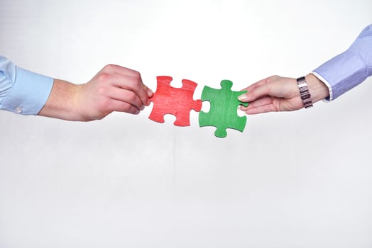 Group of business people assembling jigsaw puzzle photo