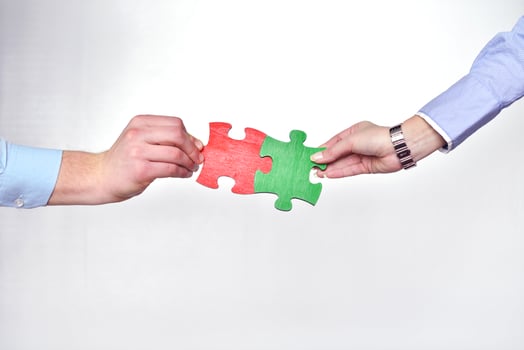Group of business people assembling jigsaw puzzle photo