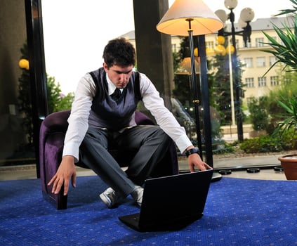young businessman working on laptop photo