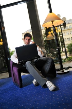 young adult working on laptop photo